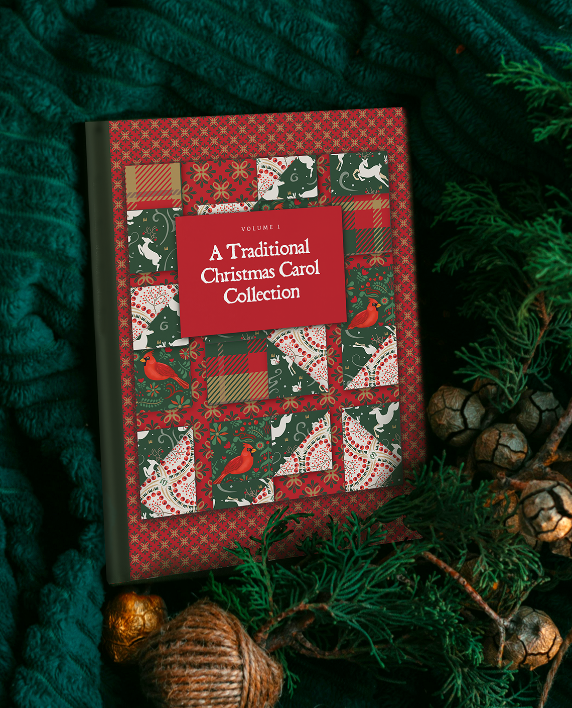 A Traditional Christmas Carol Collection book on a pine green blanket