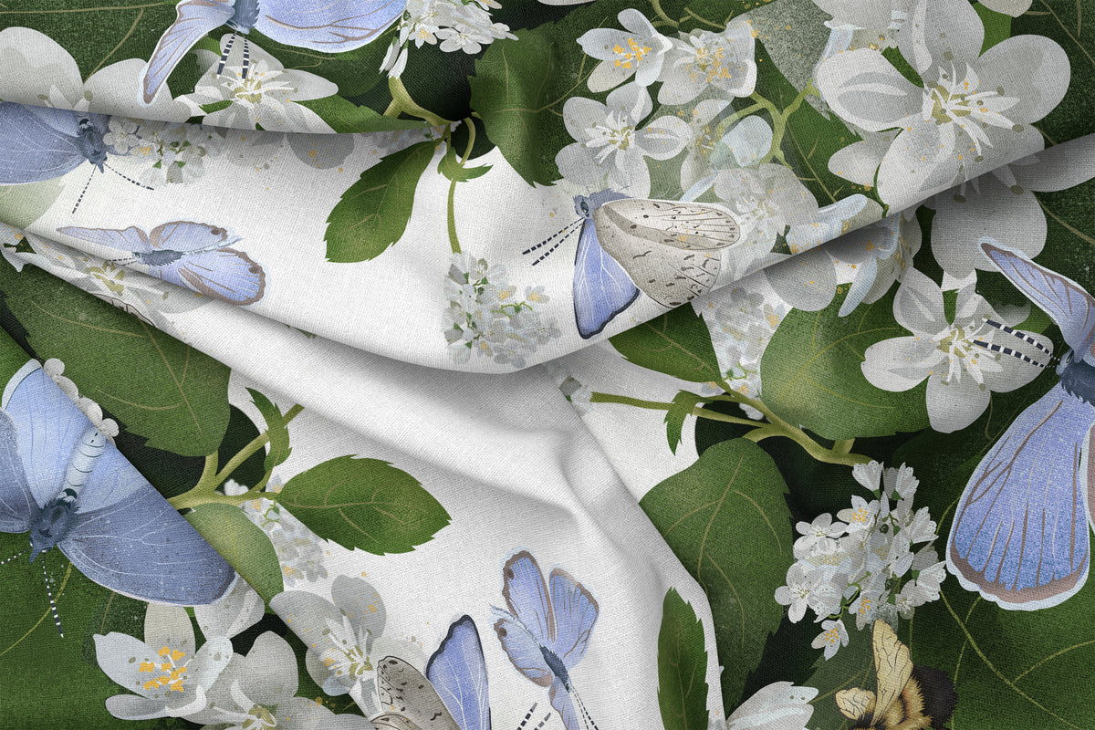 Fluid and beautifully draped silk scarf folded over, featuring blue butterflies and a few bumblebees busy at work. 