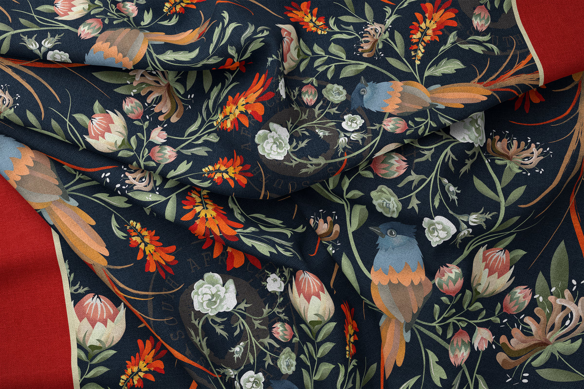 Folded detail of the South African Flycatcher bird silk scarf, with it's long, elegant tail feathers within protea, lion's tail, and wild roses. 
